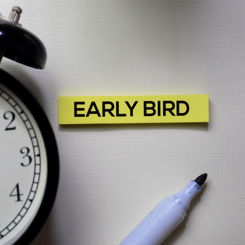 Early Bird on sticky note with marker and clock