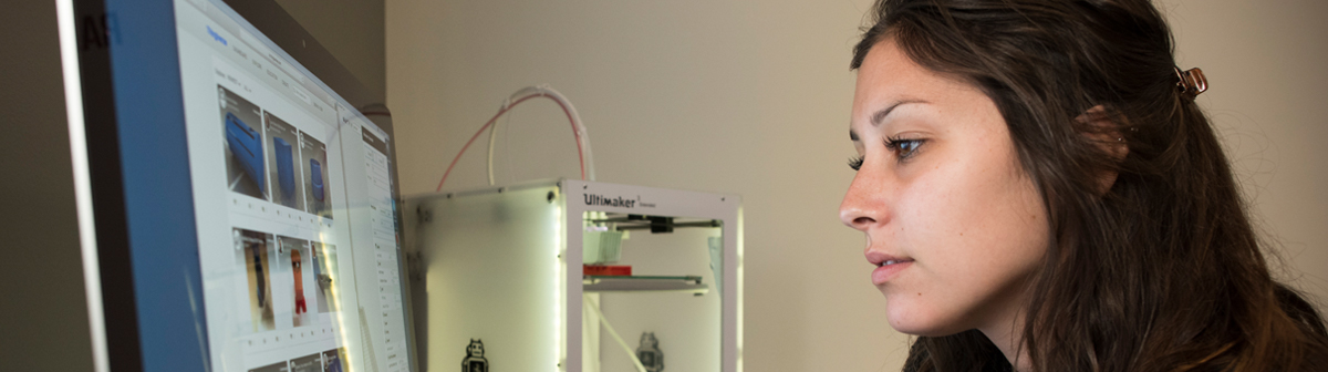 a student works on a 3d printer