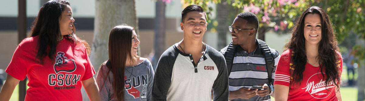 Diverse, happy students walking across the CSUN campus.