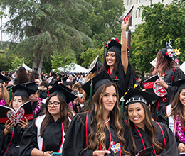 a crowd of graduates celebrate