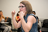 A professor signing in ASL.
