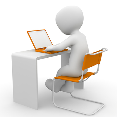 Figure of person at desk in orange chair with orange laptop