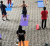 students exercising on mats
