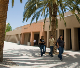 students walk in front of the college fo education